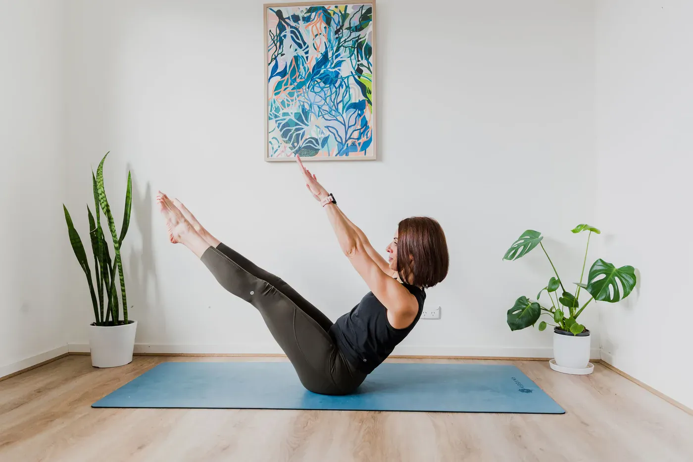 Steph in a pilates teaser position